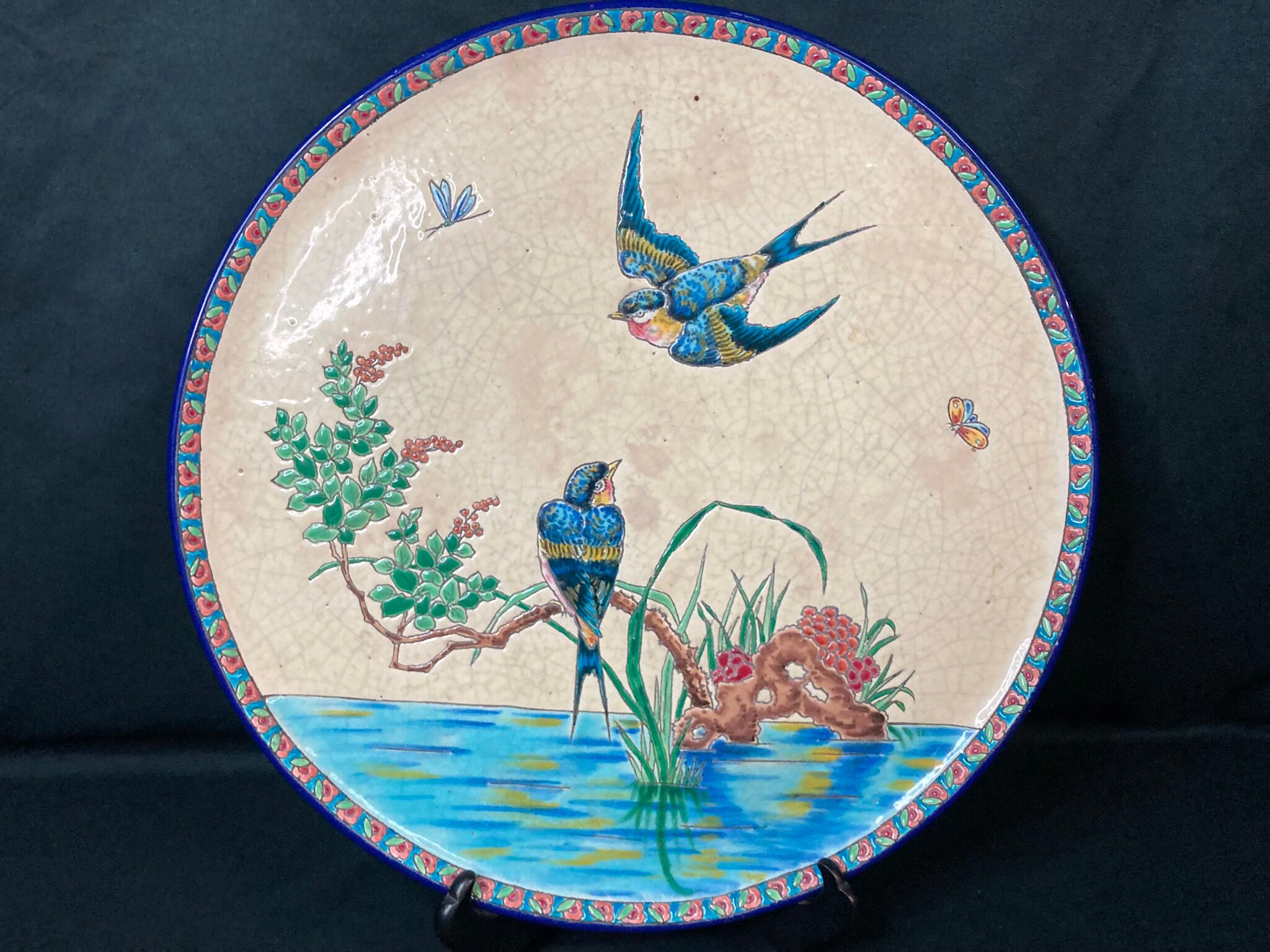 Round polychrome enamel dish with bird decoration circa 1900