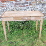 Old wooden farmhouse table with drawer
