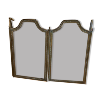 Old brass fire shield
