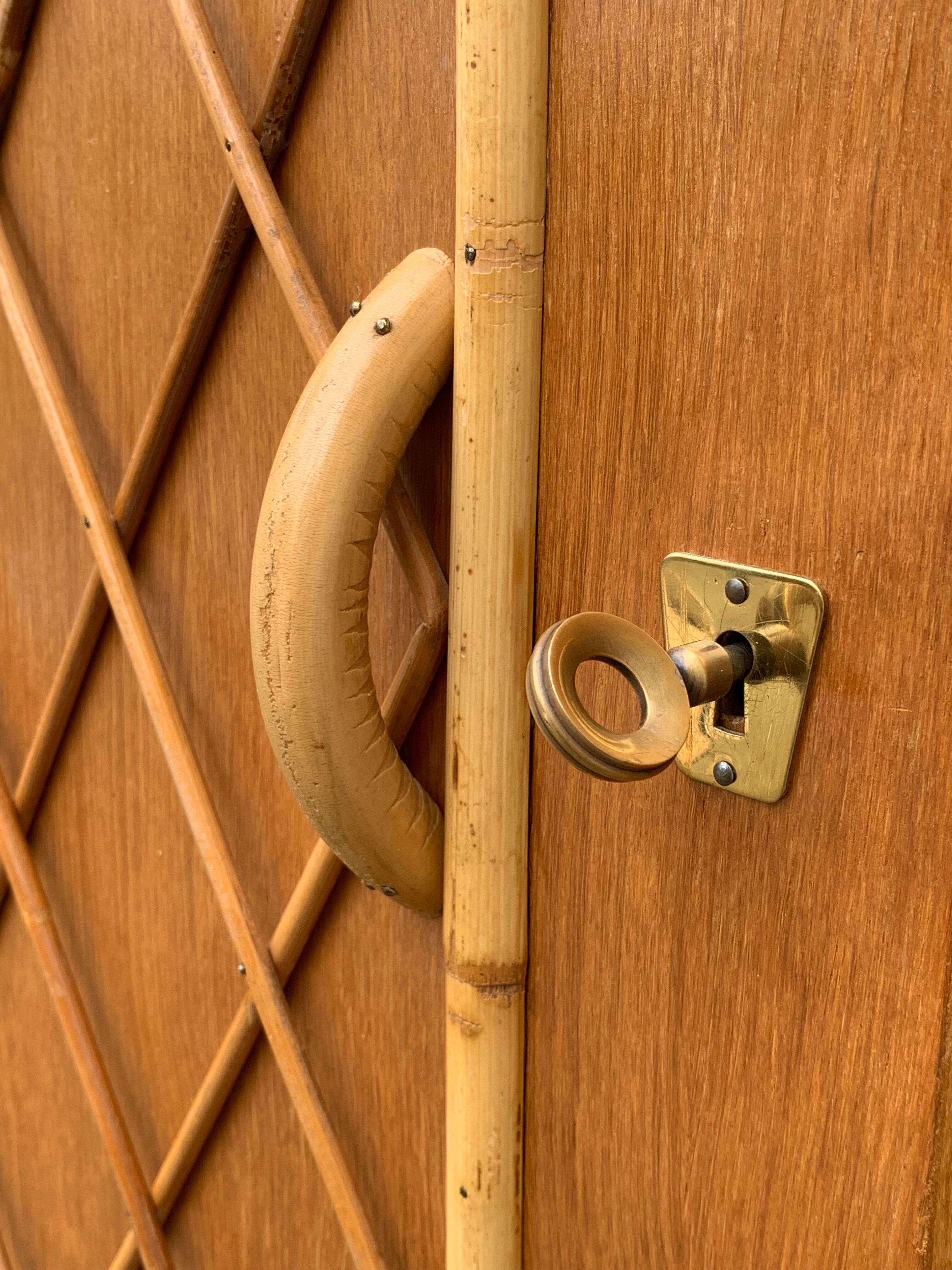 Rattan wardrobe with tapered legs from the 1960s.