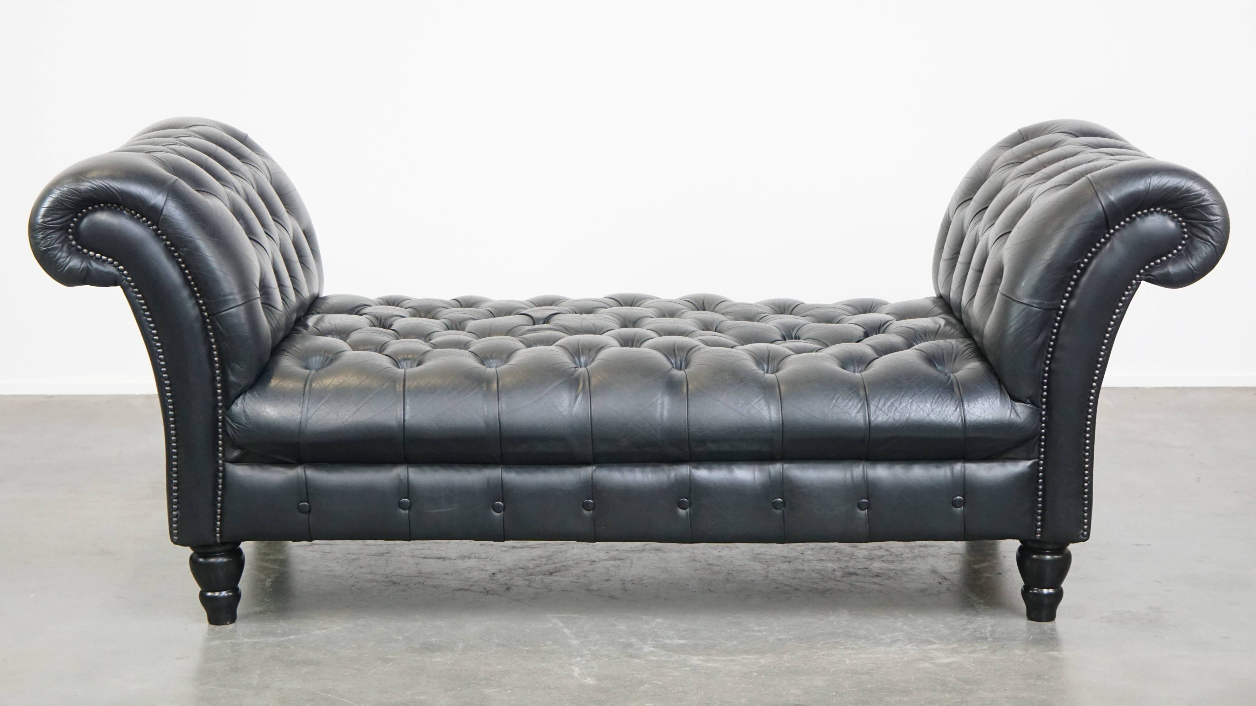 Black chesterfield daybed made of cowhide