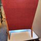 Vintage red armchair with compass feet in Scandinavian design