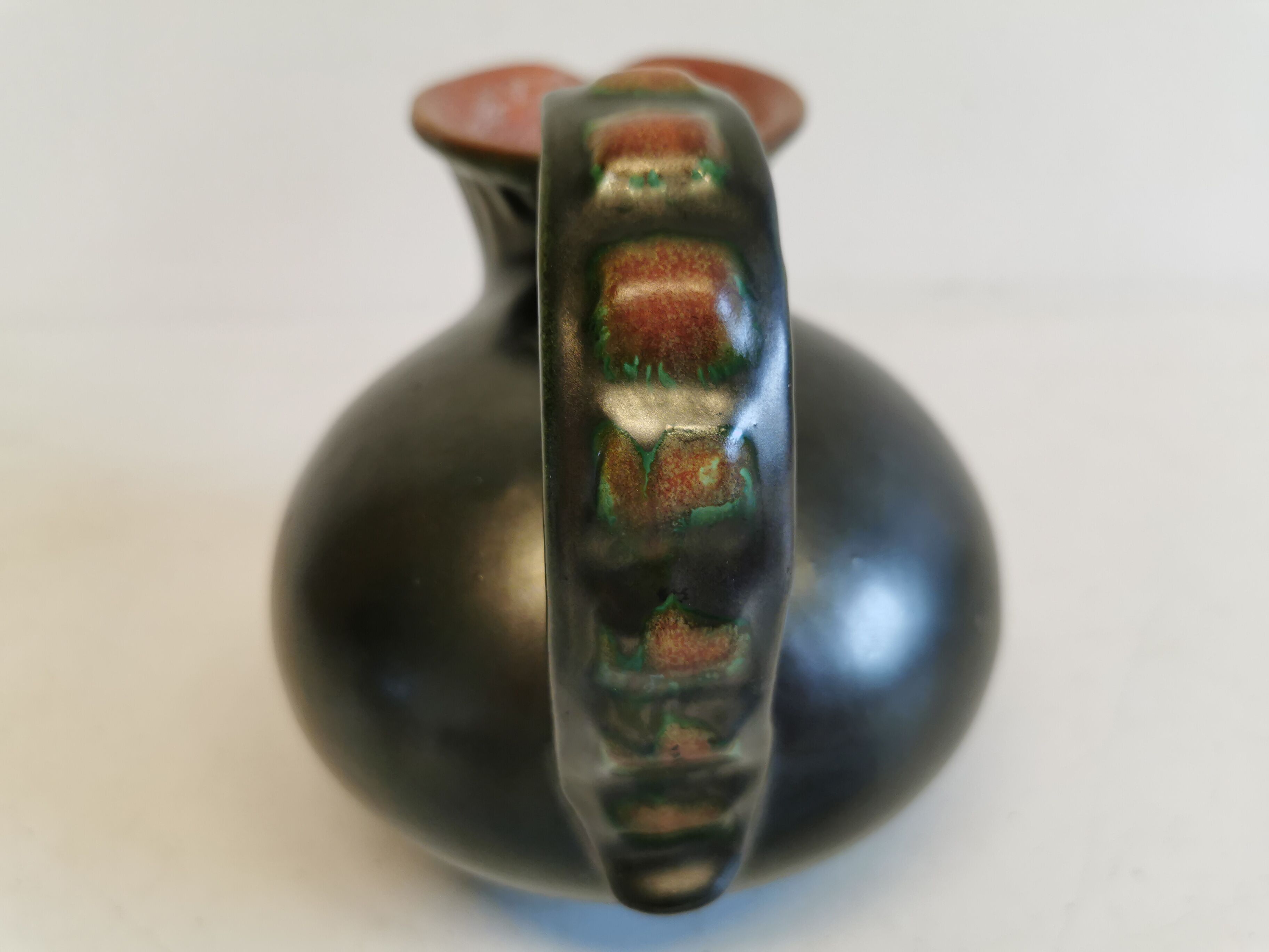 Keramic jug in metal glaze, from Danish Michael Andersen (Stamped with the 3 fish at the bottom)