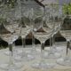 Set of 8 antique glass water glasses. Engraved floral border