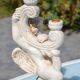 Pair of "cherub" candle holders in plaster