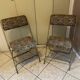 Two antique Manufrance folding chairs in metal and fabric