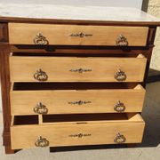 Old chest of drawers with white marble.