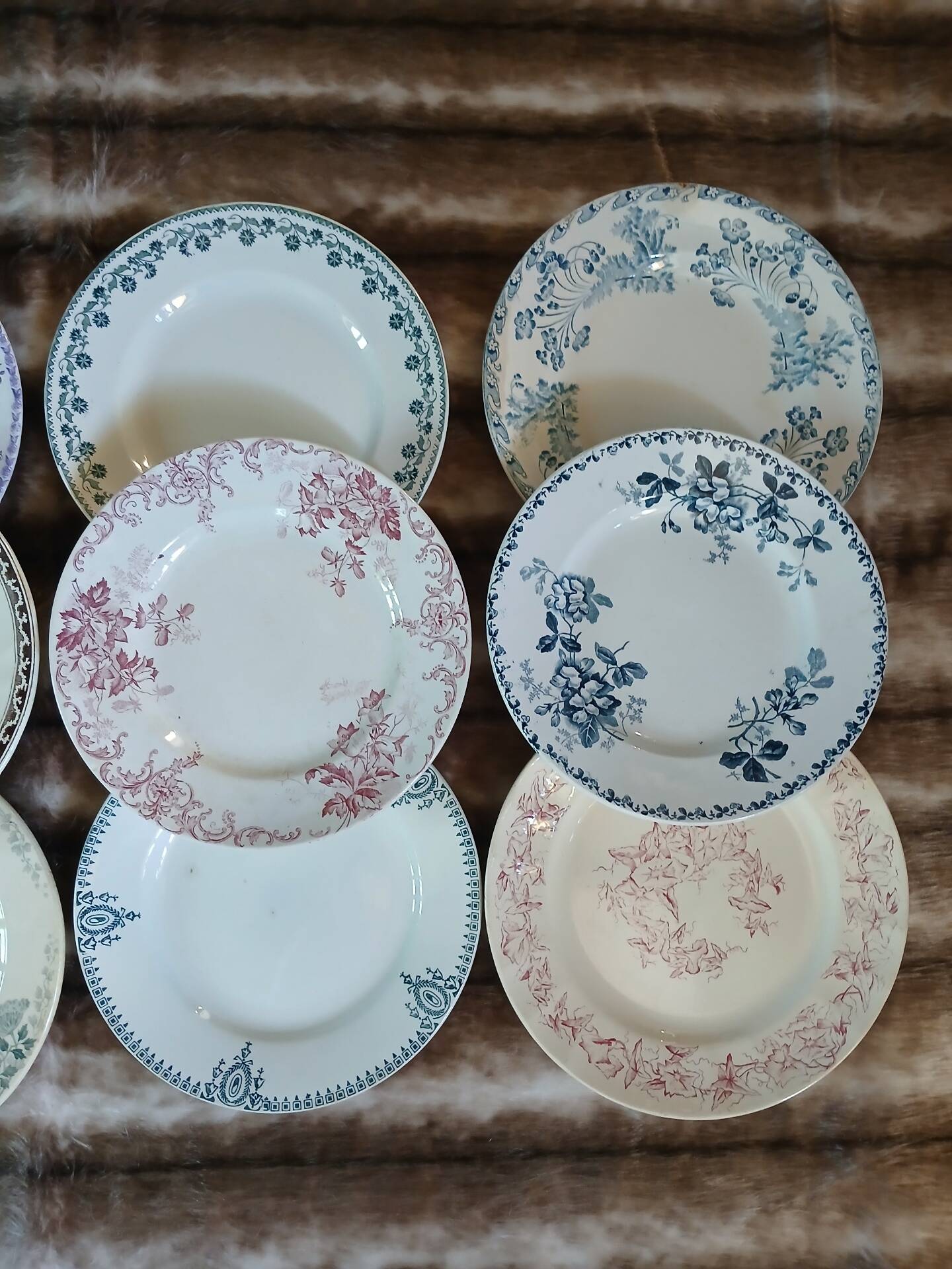13 mismatched flat plates in ironstone