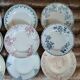 13 mismatched flat plates in ironstone