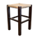Vintage rustic stool in wood with a straw seat.