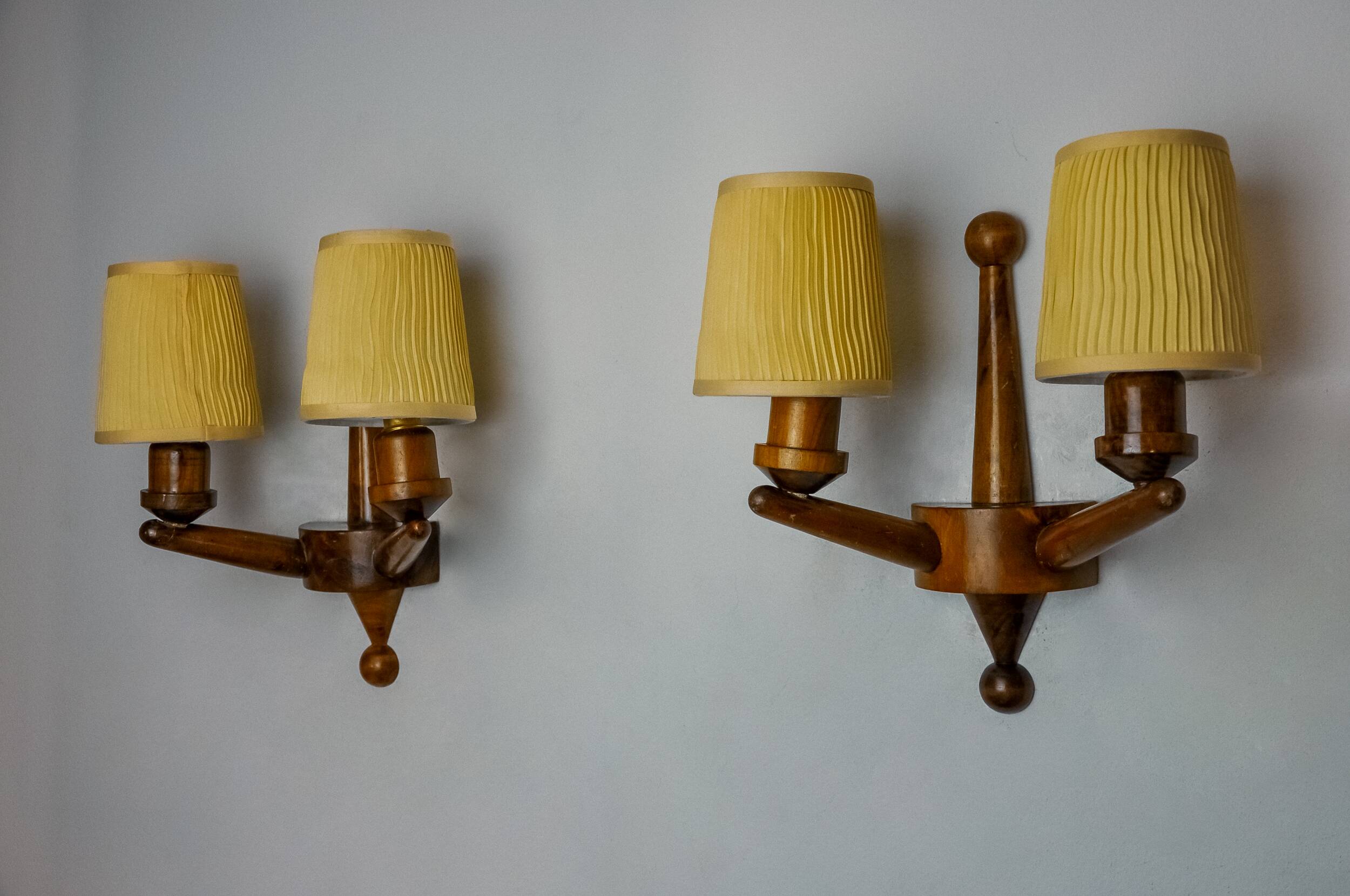 Pair of two-armed art deco wall lights, carved wood, France, 1960