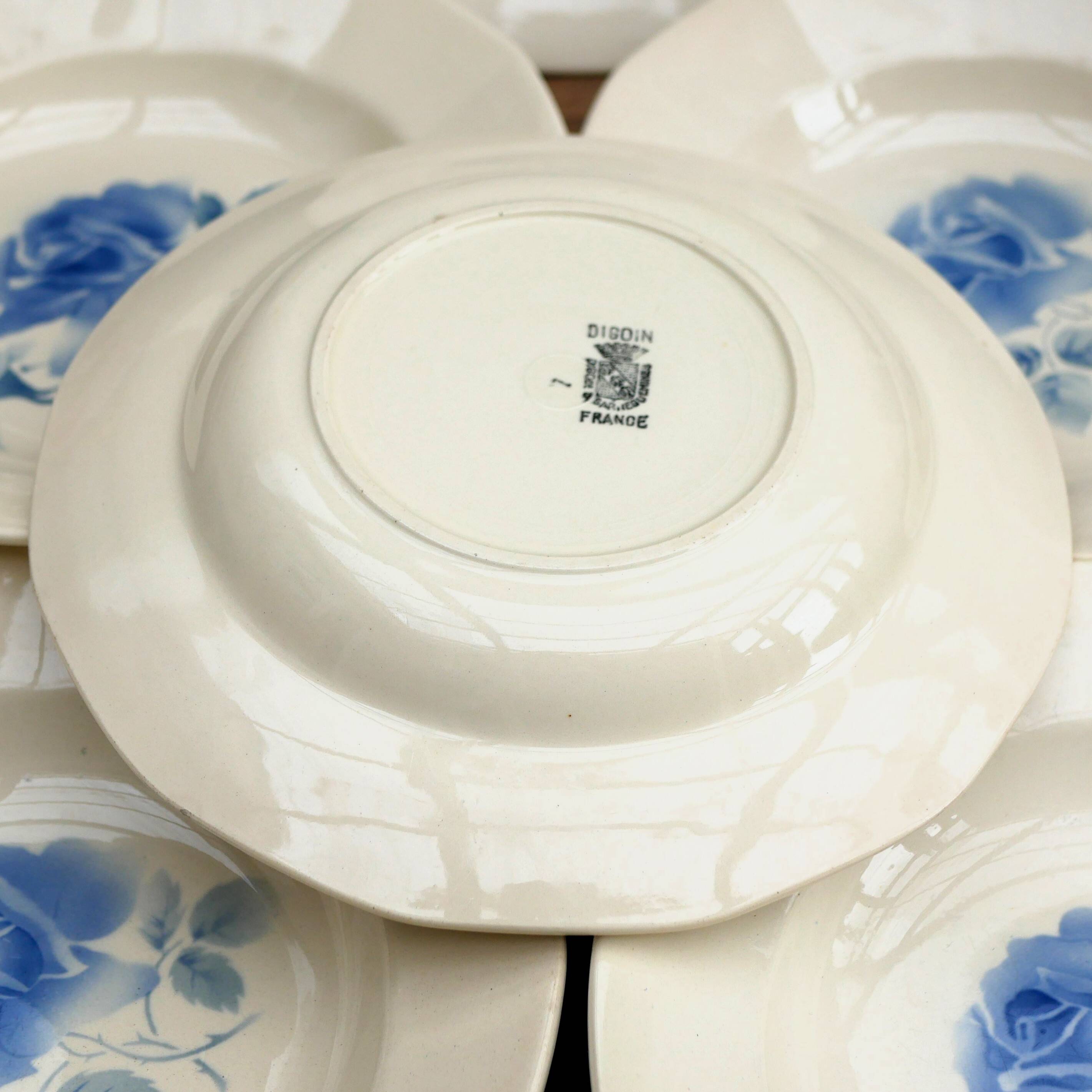 Six Art Deco Digoin earthenware soup bowls with blue rose motif