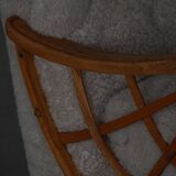 Pair of modern Swedish lounge chairs, shearling sheepskin and elm, 1940s.