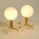 Two Mid-Century Modern rocket table lamps in brass and glass