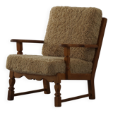 Danish modernist lounge chair in oak and lambswool, Henning Kjærnulf, 1960s