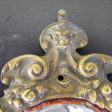 Hand-facing mirror in gilded bronze