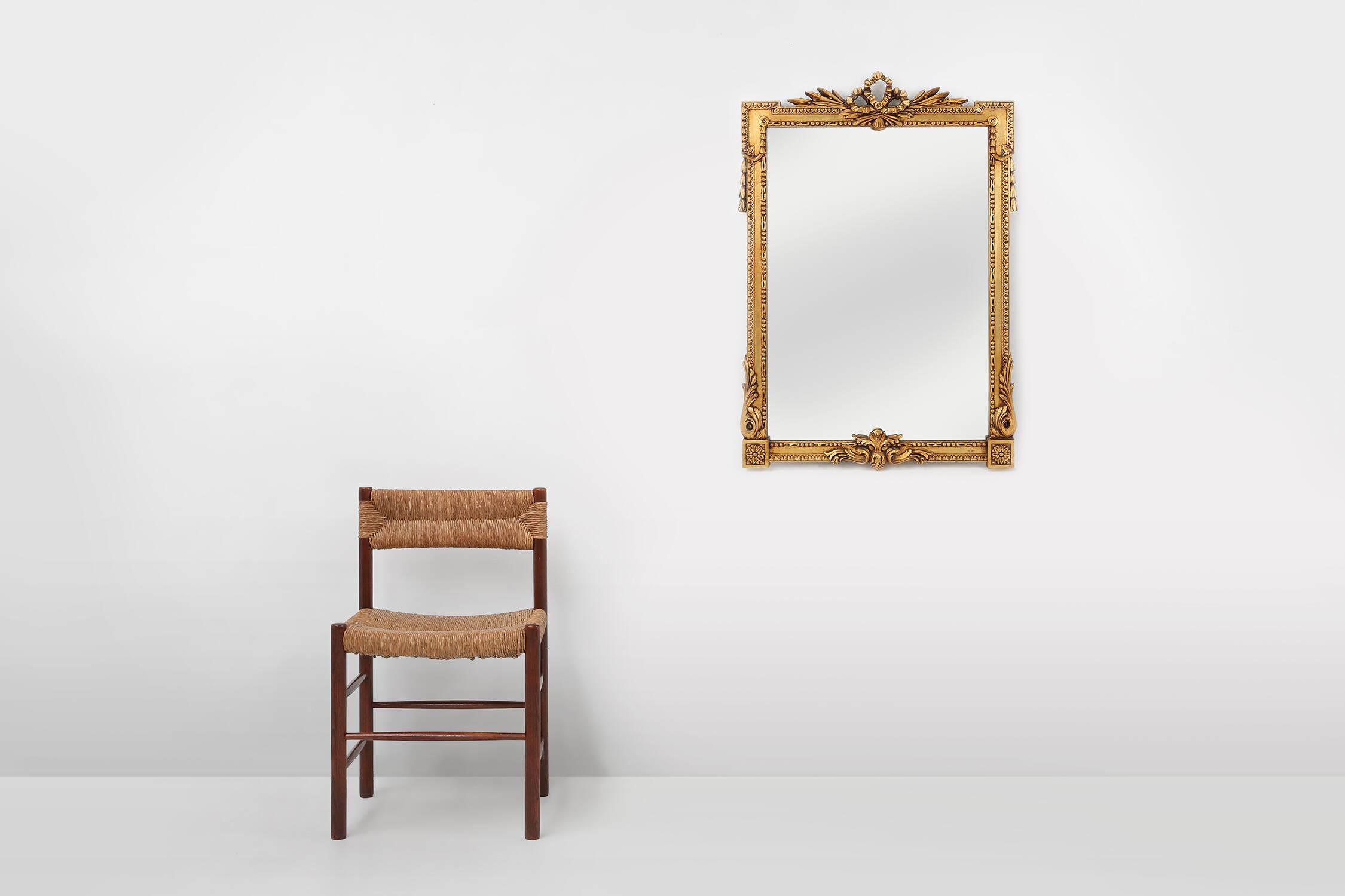 Highly decorated gilted carved wooden wall mirror, Belgium ca. 1950