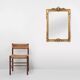 Highly decorated gilted carved wooden wall mirror, Belgium ca. 1950