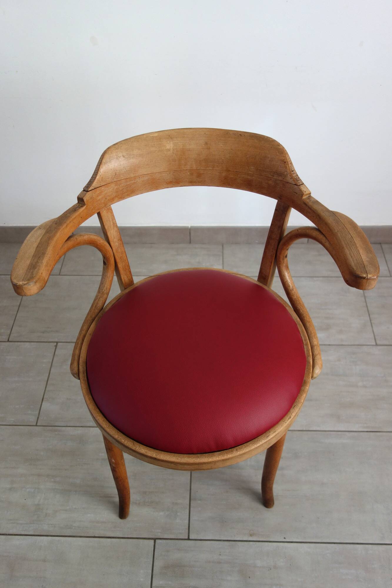 Vintage curved wooden armchair