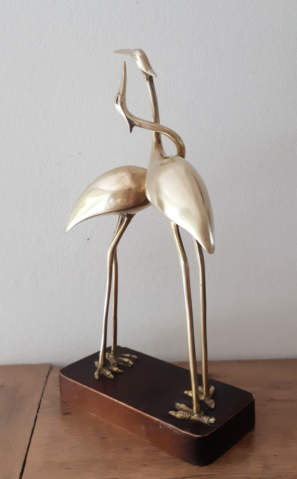 Couple of wading birds in brass on wooden base