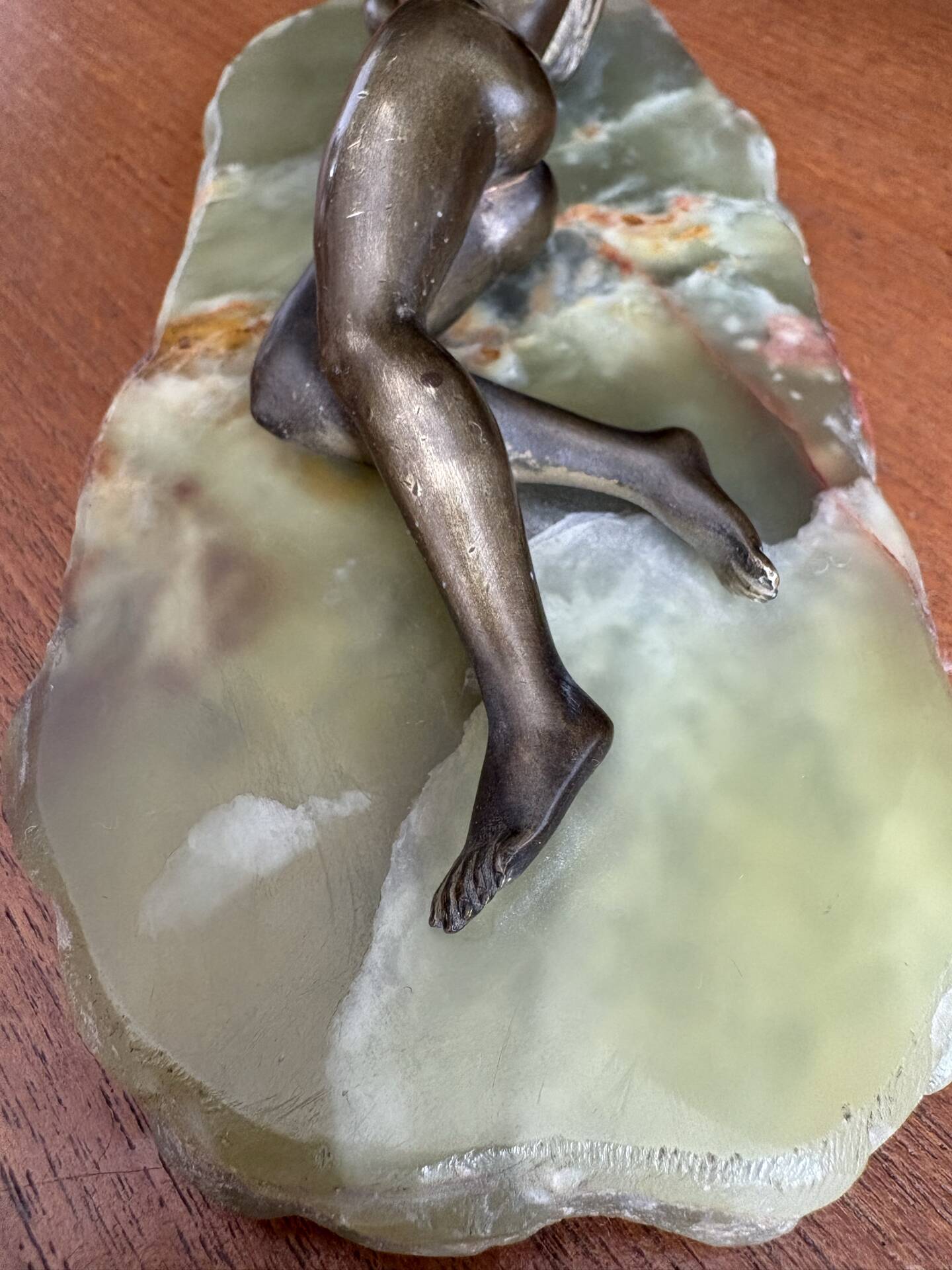 Art Deco female sculpture in bronze with onyx base.
