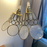 Pair of portable lamps with mother-of-pearl lampshades and brass.