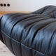 Armchair and ottoman in black leather model designed by Michel Ducaroy 1973