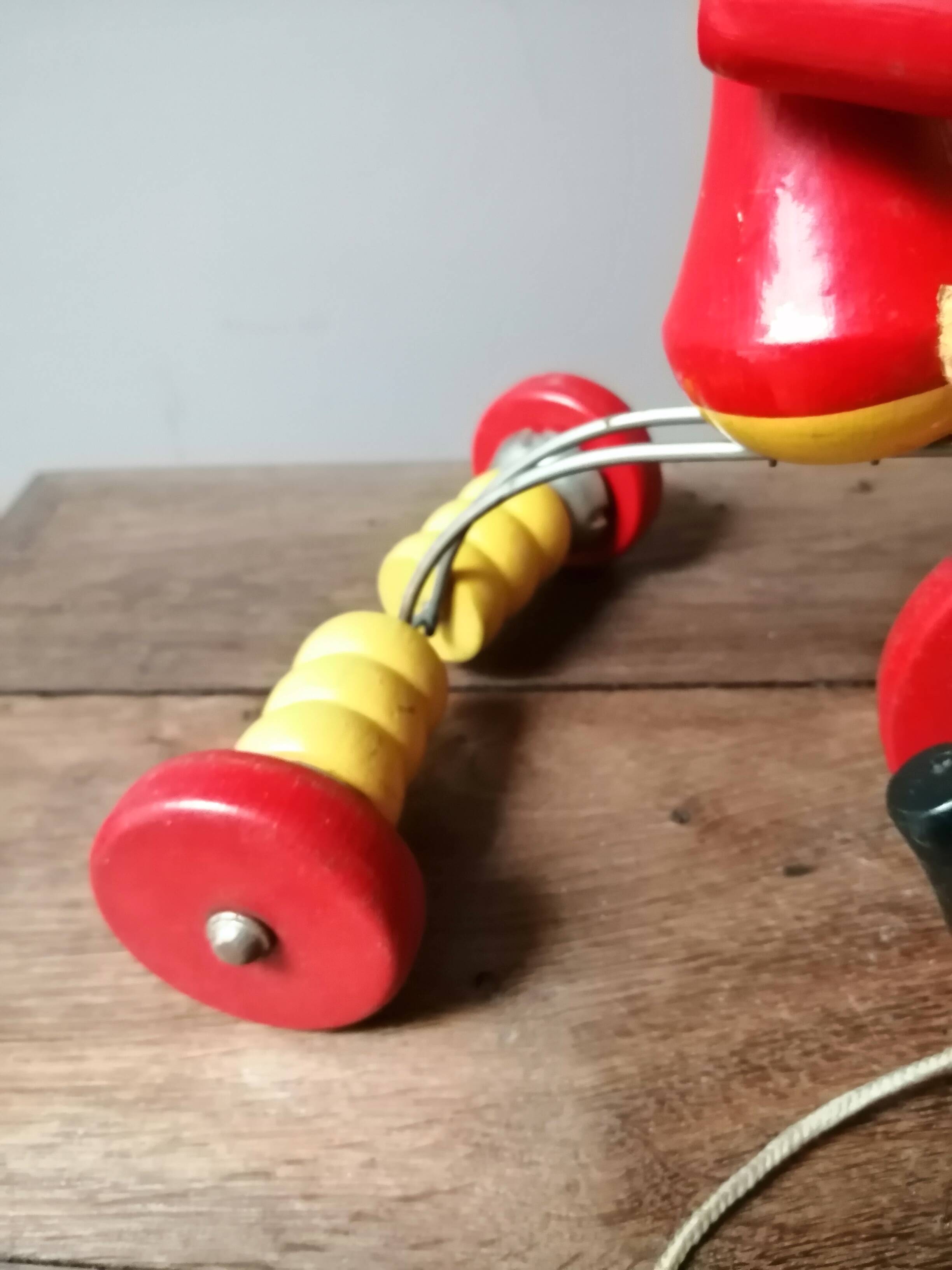 Old Mickey Mouse toy on his wooden tricycle