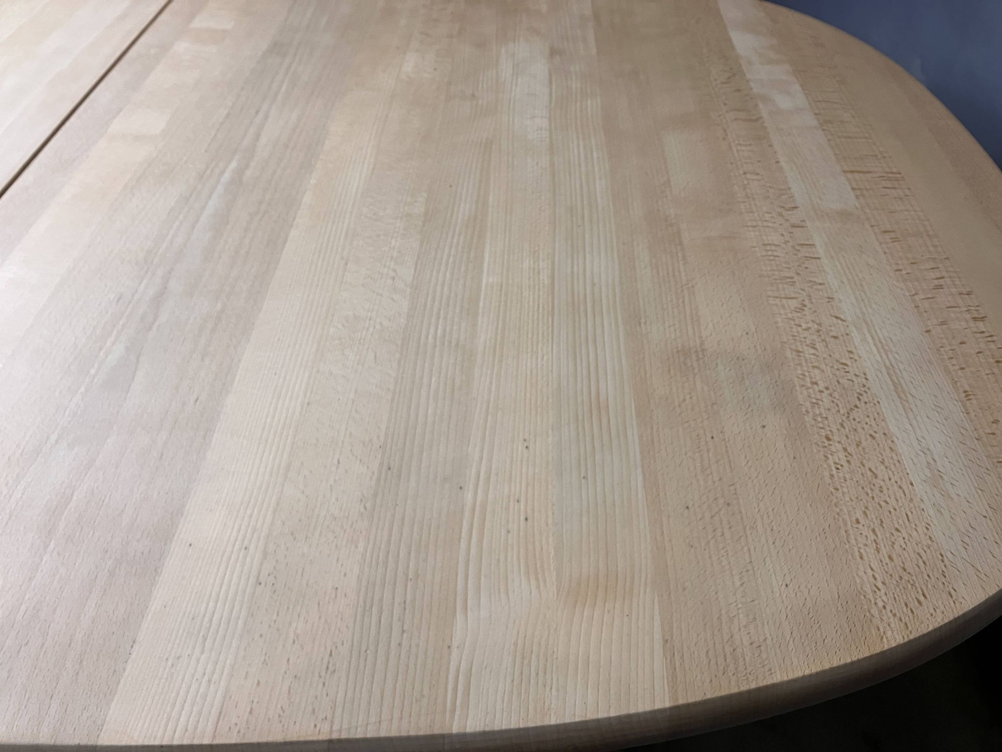Oval extendable dining table in beech with Danish design.
