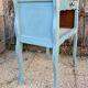 Pair of patinated lagoon blue bedside tables, early 20th century, with curved legs.