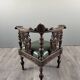 Pair of corner armchairs in carved wood, 19th century