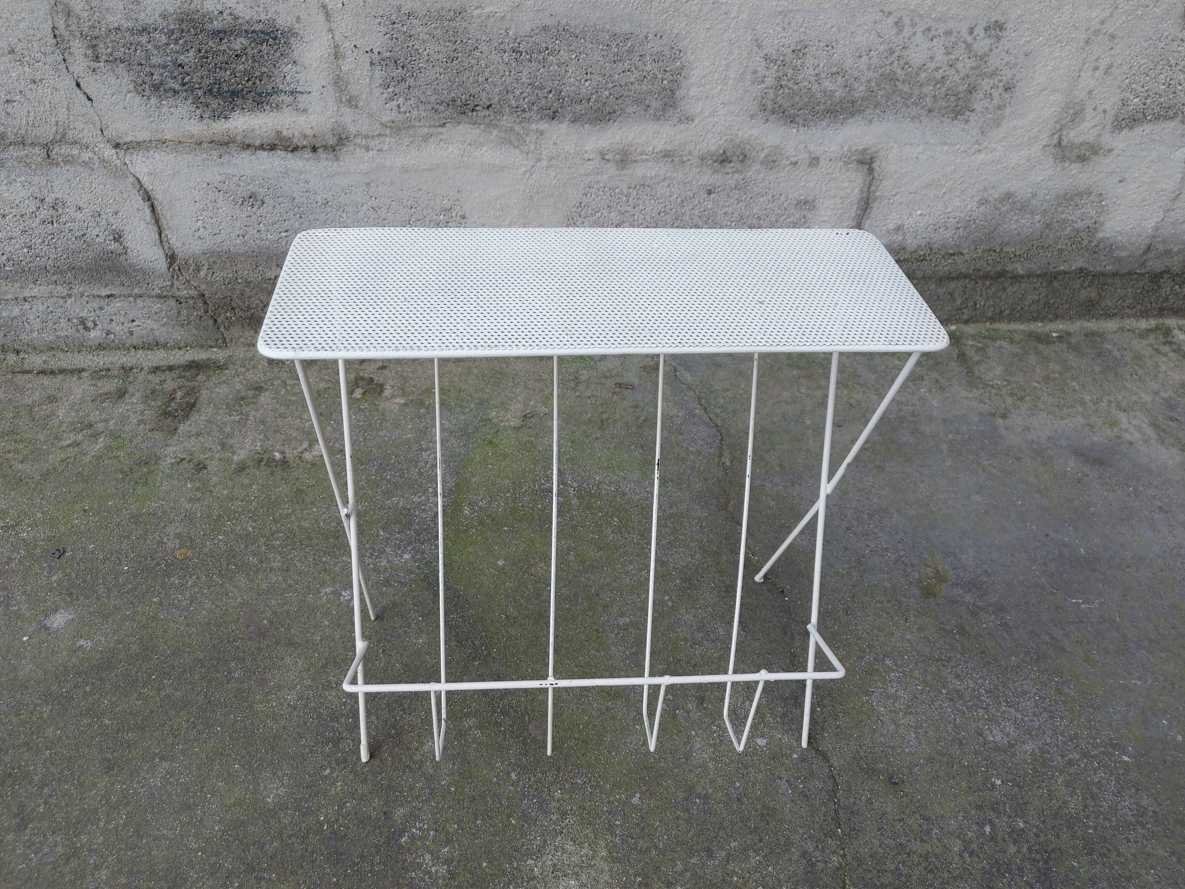 Vintage magazine holder in perforated metal