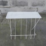 Vintage magazine holder in perforated metal