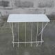 Vintage magazine holder in perforated metal