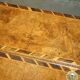 Antique George II bureau from 1740 in walnut, rosewood, and leather.