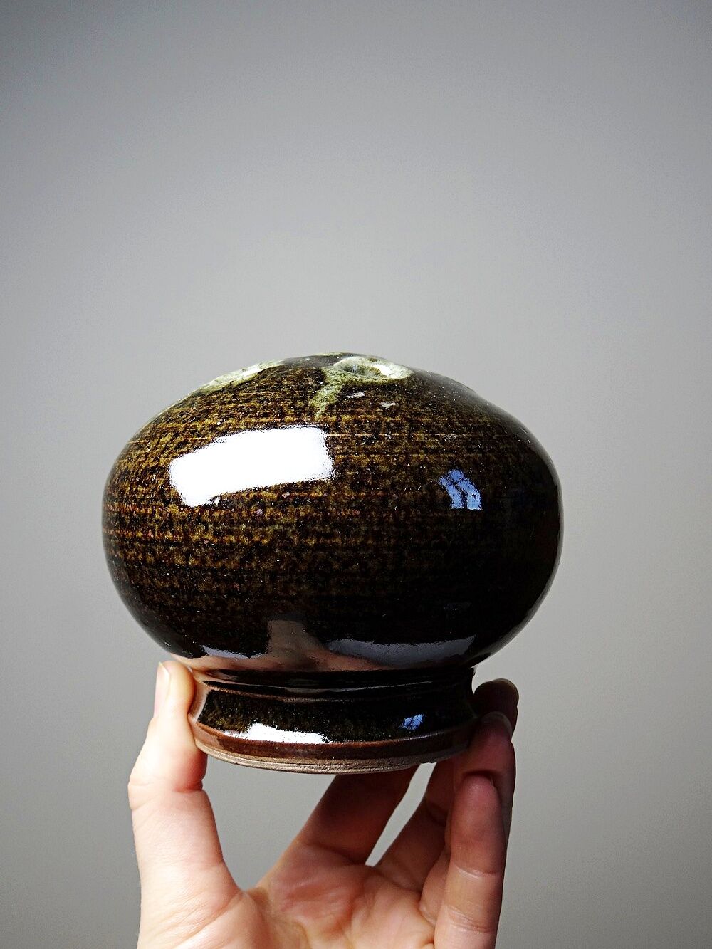 Brown and green glazed stoneware flower holder, vintage craftsmanship from the 1970s-1980s.