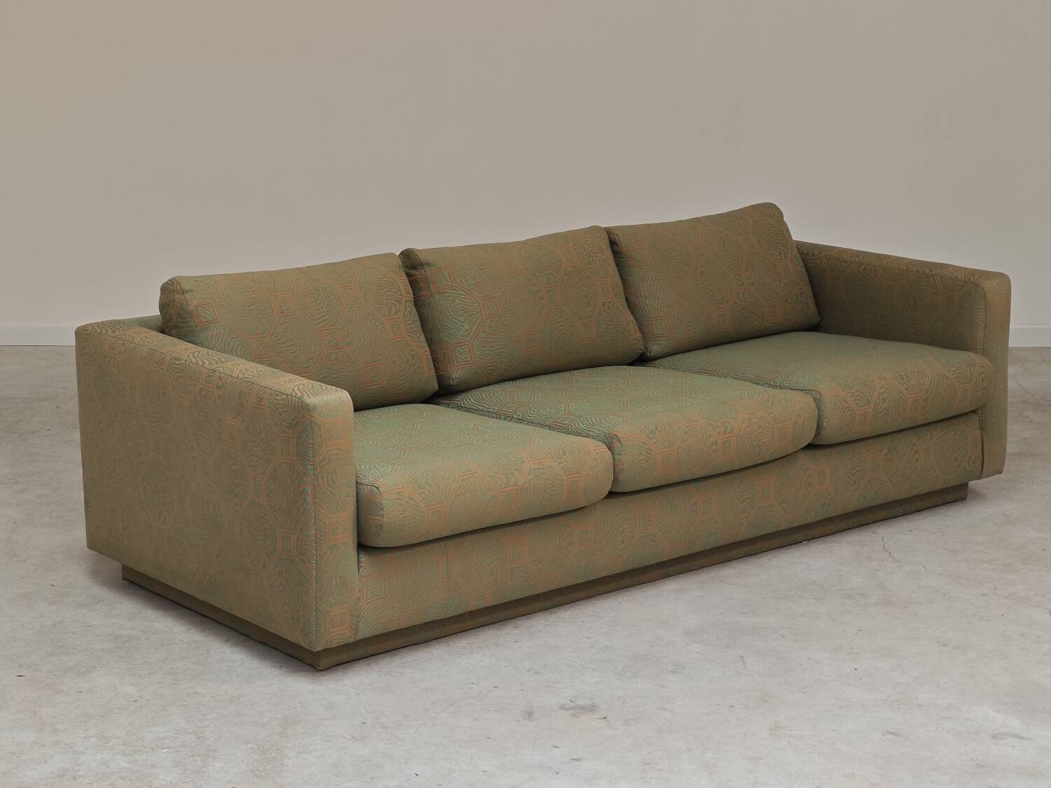 Pierre Frey modernist bench in green and gold patterned fabric