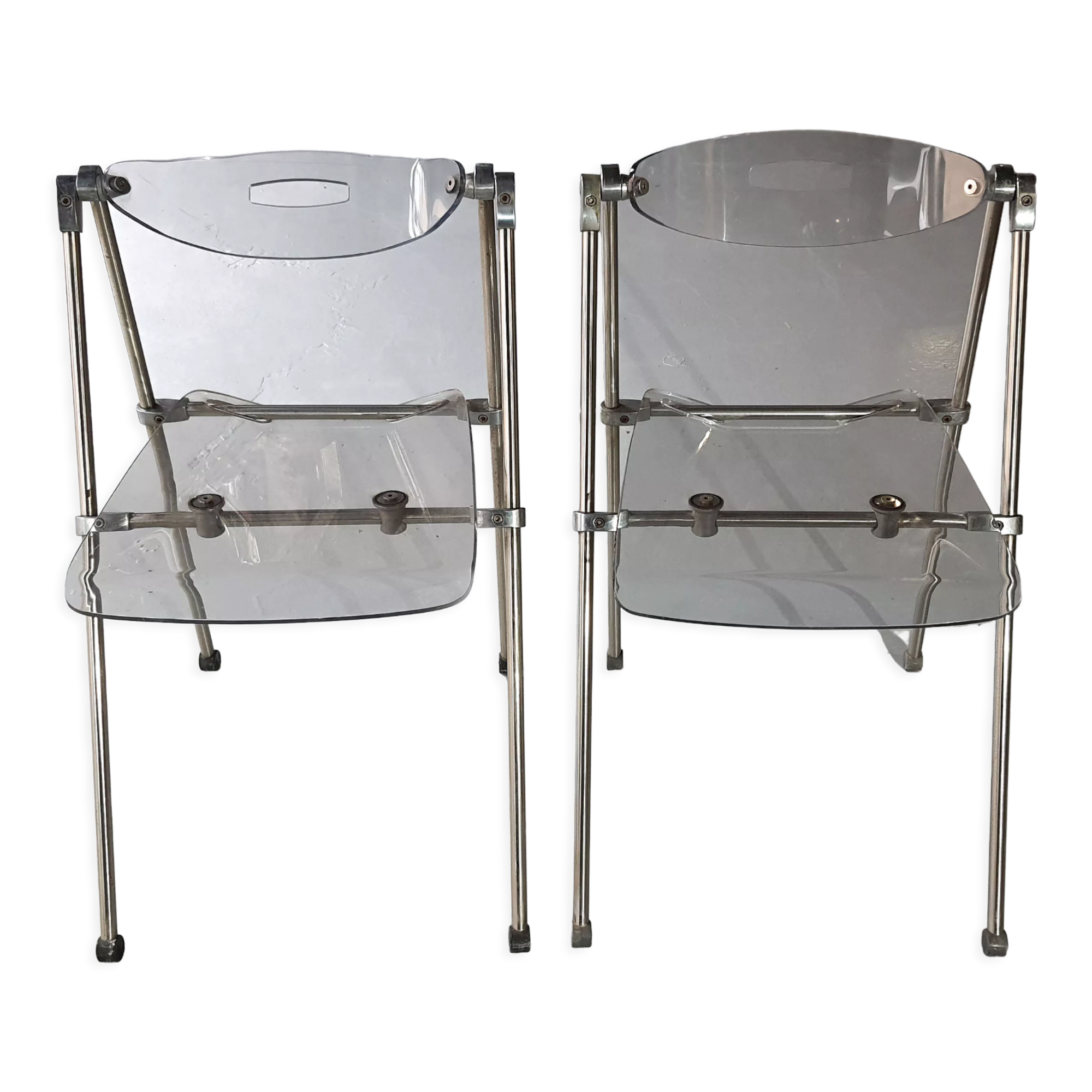 Pair of modern folding chairs in plexiglass