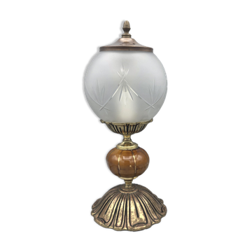 Hollywood Regency bedside lamp in gold metal with a glass globe.