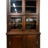 Vintage wooden display cabinet with sliding doors.