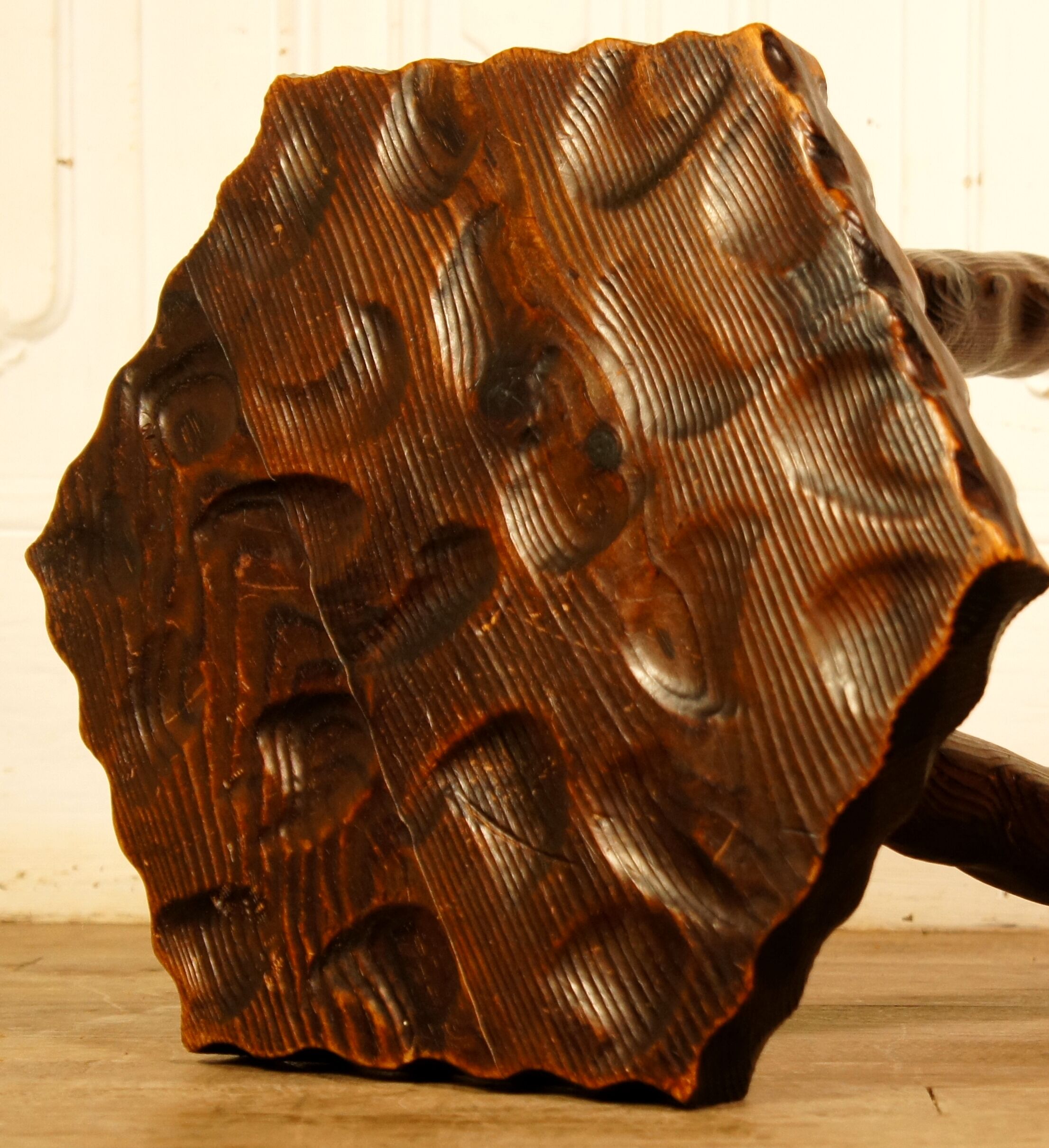 Brutalist tripod stool cut with gouge