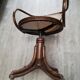 Office chair with curved wood swivel screw and Thonet cannage