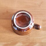 Caramel brown ceramic mugs with geometric flower pattern from the 70s