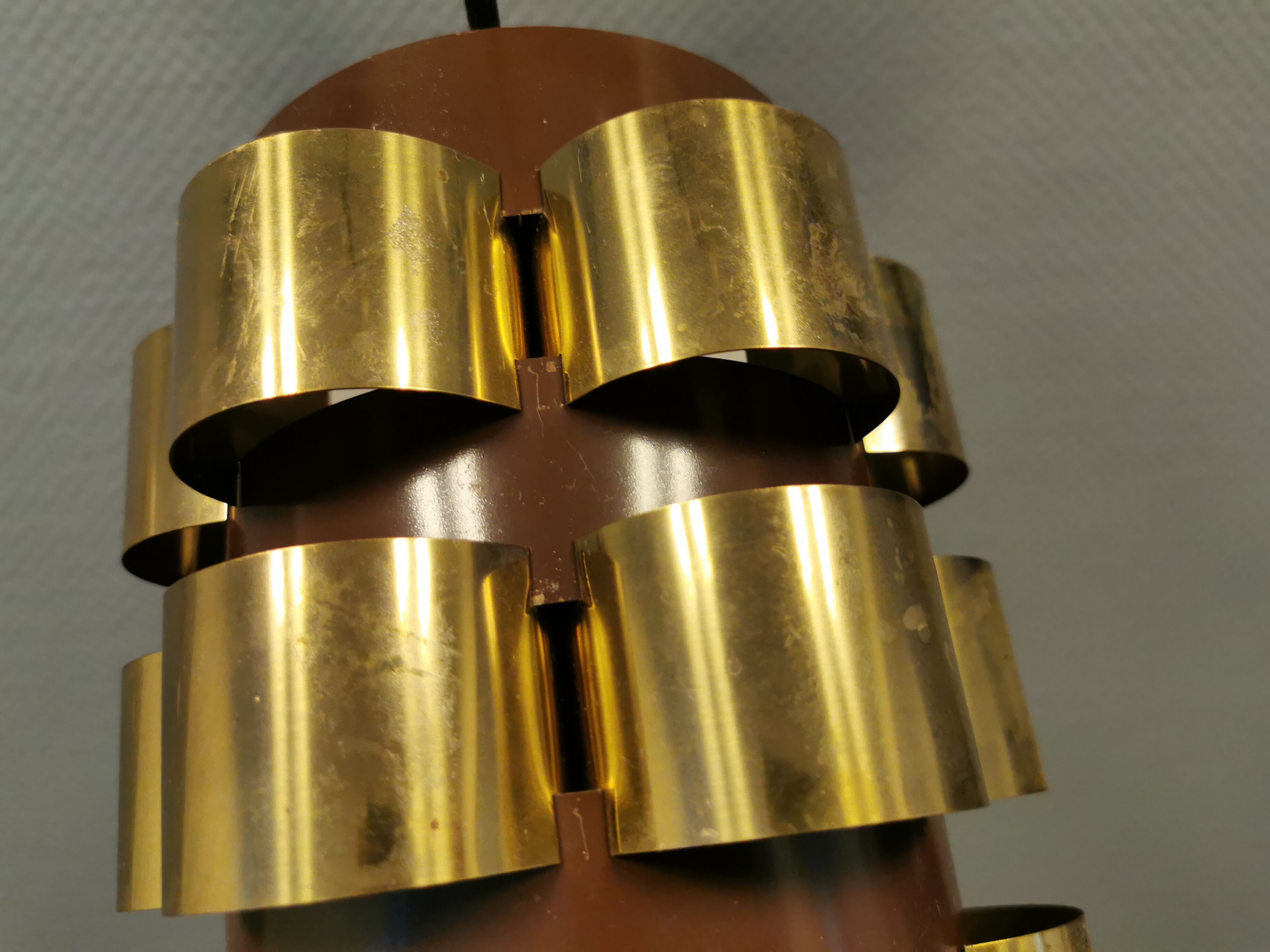 Danish hanging lamp from the 70s, in thin cut metal.