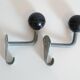 Pair of school coat hooks in Bakelite and metal from the 1950s.