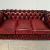 Three-seater red leather chesterfield sofa