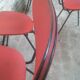 Lot of 6 red chairs in faux leather metal compass feet