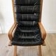 Scandinavian armchair in wood and leather.