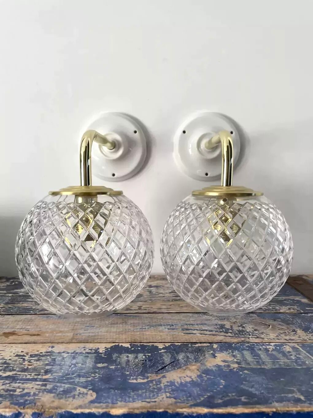 Pair of brass and glass wall sconces