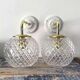 Pair of brass and glass wall sconces